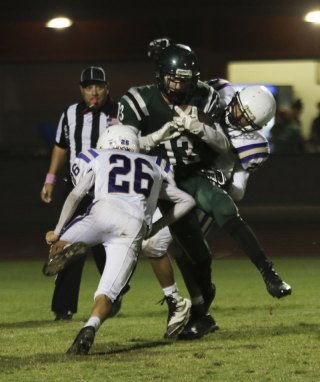 Lemoore's Damien Charleston keys in on an El Diamante player Friday night in Visalia.